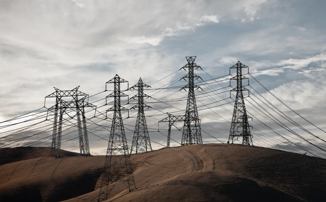 High powered Transmission towers on hills.